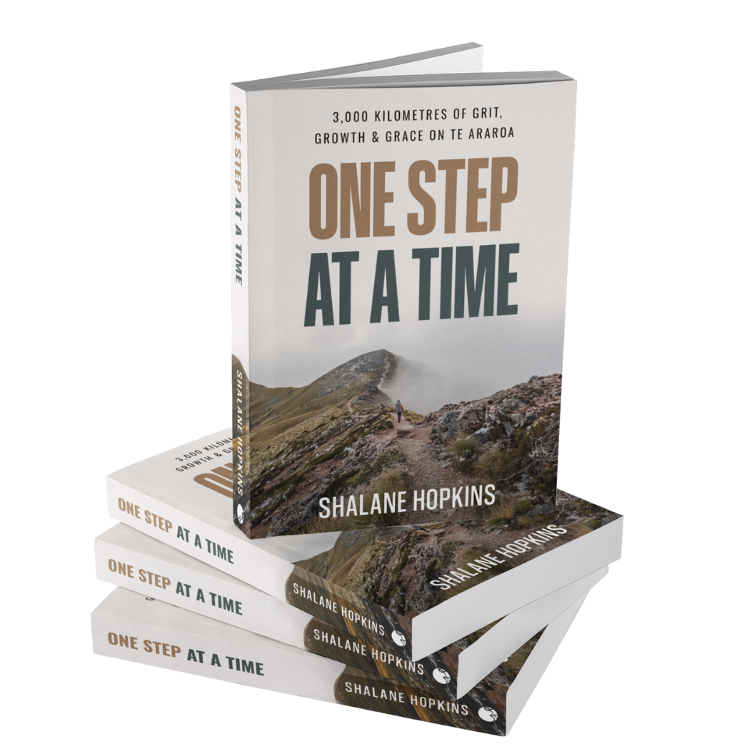 Stack of One Step at a Time paperbacks by Shalane Hopkins, showing book cover design and title.